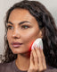 The model wearing Blyss Mira – Photon LED & High-Frequency Vibration Facial Device
